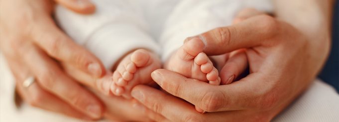 Little baby in his mom's hands