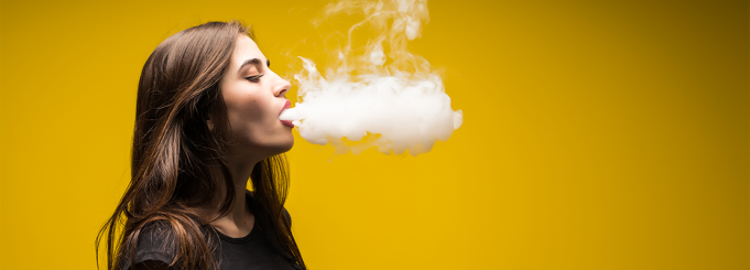 Young woman vaping